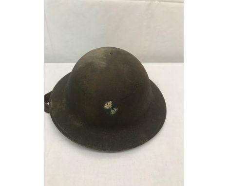 A M1917 US "Doughboy" tin hat, marked to the inside ZA179 with blue and white circular divisional patch painted to the front 