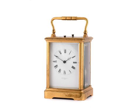 A Brass Five Minute Repeating Carriage Clock, retailed by John Hall &amp; Co, Paris, circa 1890, carrying handle and two repe