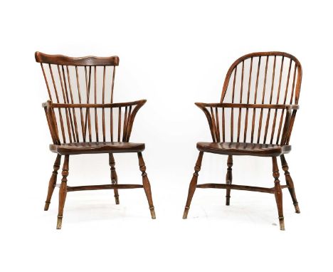 A 20th Century Ash and Elm Windsor Armchair, the comb shaped top rail above a double spindle back support with curved arm sup