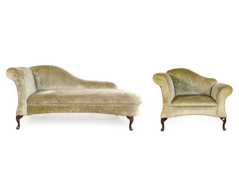 G&M Laurence Furnishings: A Modern Snuggle Armchair, upholstered in green velvet with removeable scatter cushion, the humpbac