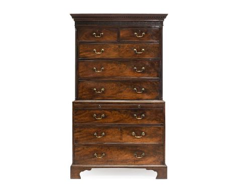 A George III Mahogany and Oak-Lined Chest on Chest, late 18th century, the Greek Key dentil cornice above a blind fret-carved