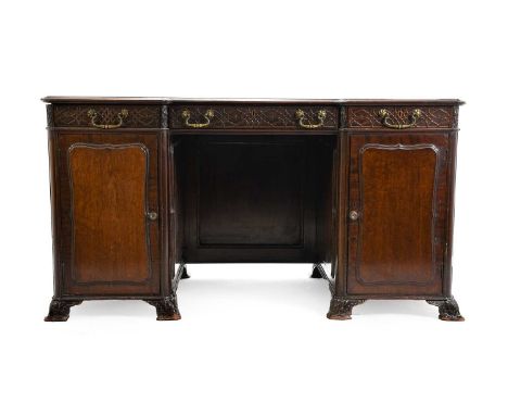 A 19th Century Mahogany and Blind Fret Carved Desk, in George III Chippendale style, the moulded top with green and gilt leat