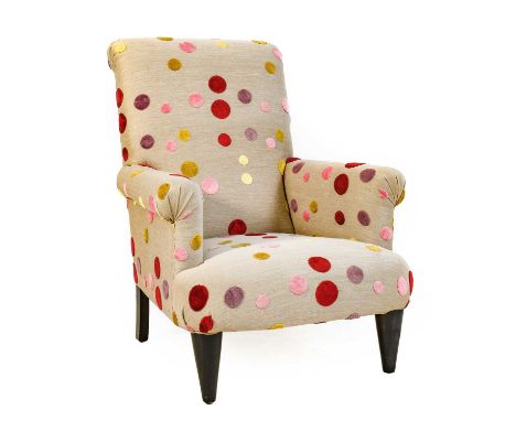 G &amp; M Lawrence Furnishings: A Modern Armchair, covered in grey cotton with multicoloured spots, with overstuffed rounded 