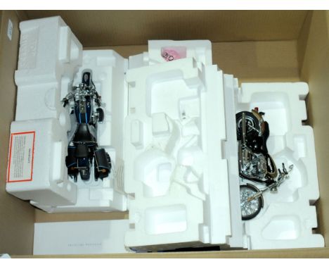 Franklin Mint. A partly boxed pair of 1:10 scale Harley Davidson motorcycles comprising of 2004 XL 1200CC Sportster Custom wi