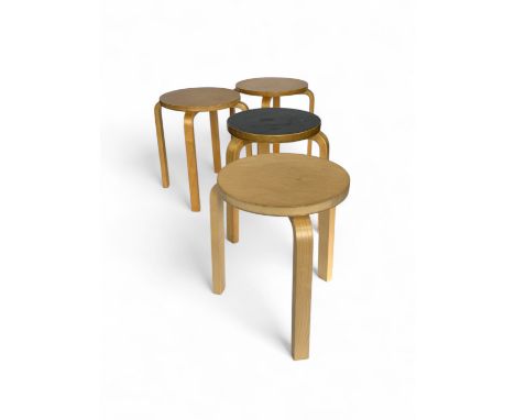 A vintage Alvar Aalto birch three-legged stool for Artek with another stool for Aalton and two others
The first stool with bl