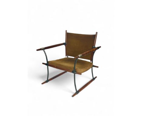 A vintage Danish Stokke lounge chair by Jens Quistgaard for Nissen Langaa
The rectangular brown/green suede back and padded s