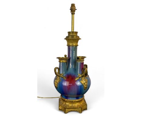 A late 19th / early 20th century blue and red flambé glazed gilt bronze mounted vase converted to a table lamp In the Louis X