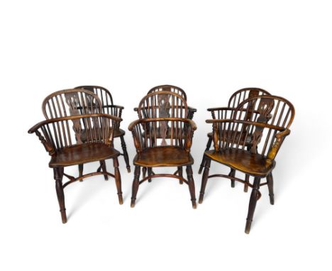 A matched set of six ash and elm Windsor armchairs, Thames Valley, circa 1850 The bowed spindle backs with pierced splats abo