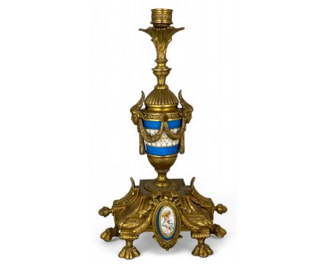 A late 19th century French gilt bronze and porcelain mounted candlestick converted to a table lamp
In the Louis XVI style, of