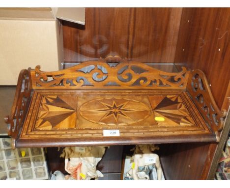 AN INLAID MAHOGANY CARVED TRAY/SHELF; 