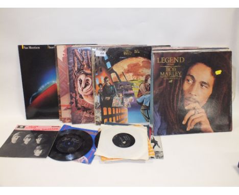 A COLLECTION OF LP RECORDS AND 7" SINGLES TO INCLUDE ROLLING STONES, BEATLES TRB ETC