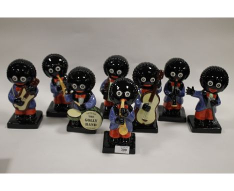 A LIMITED EDITION CARLTONWARE CERAMIC GOLLY BAND (8)