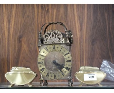 A VINTAGE STYLE ALARM CLOCK TOGETHER WITH TWO TABLE LIGHTERS