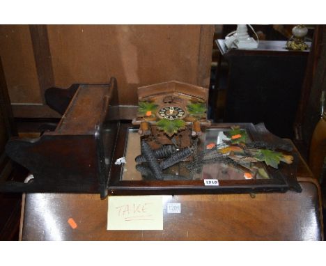A SMALL HALL MIRROR, a modern cuckoo clock, a modern small three drawer CD rack, a small basket sewing box and a nest of thre