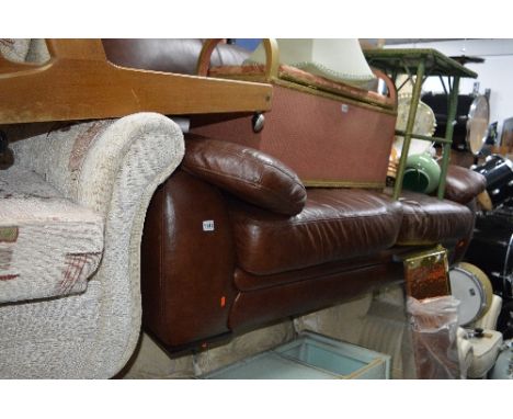 A BROWN LEATHER LARGE TWO SEATER SOFA