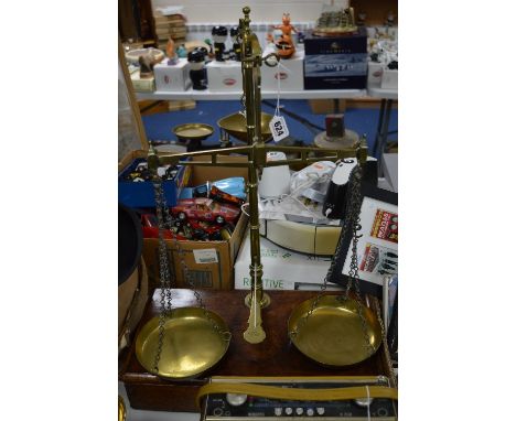 A SET OF W&T AVERY VICTORIAN BRASS BALANCE SCALES, on mahogany base with single drawer, overall height approximately 64cm 