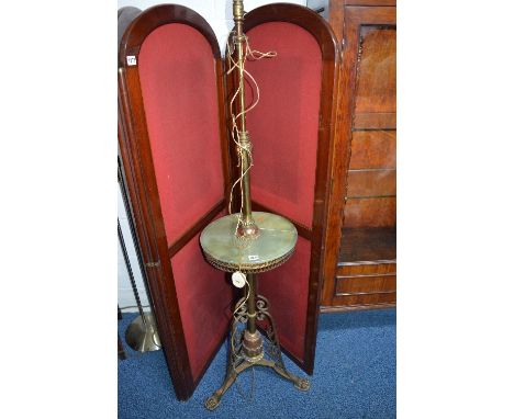 AN ART NOUVEAU BRASS, COPPER AND ONYX STANDARD LAMP, the central shelf above triple scrolled brass legs, approximate height 1