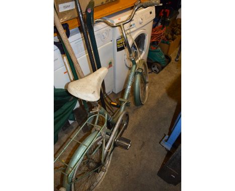 A VINTAGE HERCULES COMPACT FOLDING BICYCLE, in metallic mint green