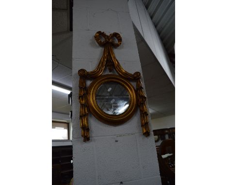 A GILT FRAMED OVAL WALL MIRROR, a chrome table lamp with shade and another table lamp of a cherub (3)