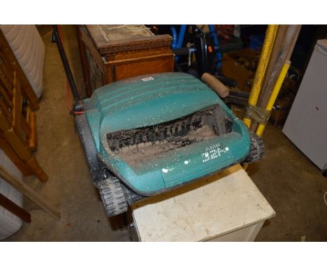 A BOSCH ELECTRIC SCARIFIER, and two bundles of garden tools