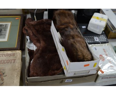 TWO BOXED FUR STOLES AND A CAST FINIAL (?) height approximately 16cm (3)