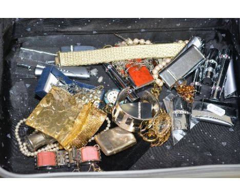 A TRAVEL CASE WITH CONTENTS OF MIXED COSTUME JEWELLERY, LIGHTERS etc