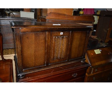 AN OAK BLANKET CHEST, with linenfold detail to front panel