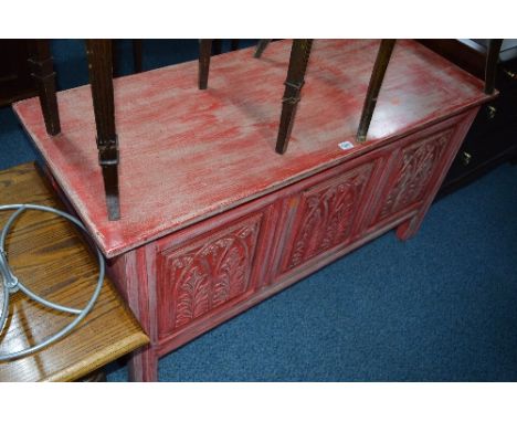 A PAINTED MAHOGANY TRIPLE PANEL BLANKET CHEST