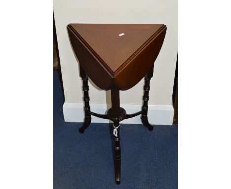 AN EDWARDIAN MAHOGANY TRIANGULAR TRIPLE DEMI LUNE DROP LEAF OCCASIONAL TABLE, on turned supports united by a stretcher and ce