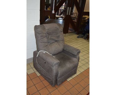A PRIDE UPHOLSTERED ELECTRIC RISE AND RECLINE ARMCHAIR, (receipt of purchase and manual included)