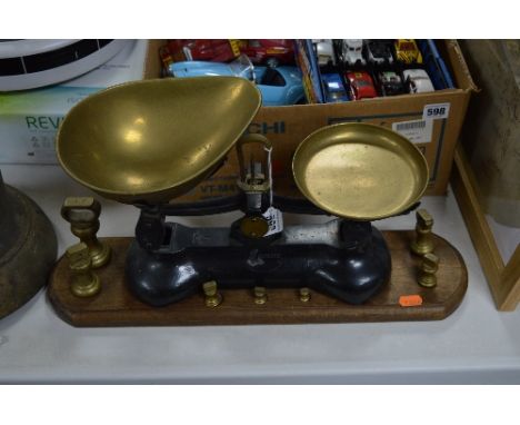 A SET OF LIBRASCO SCALES AND WEIGHTS, with wooden plinth