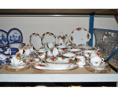 A ROYAL ALBERT OLD COUNTRY ROSES DINNER SERVICE, (over 55 pieces), including tureen (glued handle), six 26cm plates, six 20.5