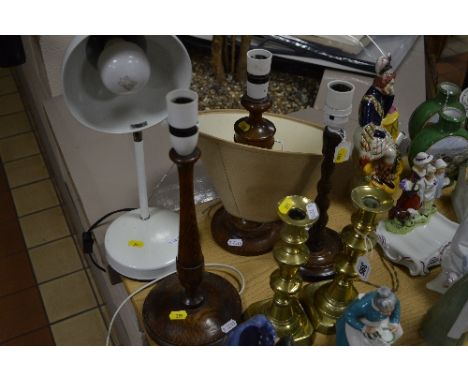 A PAIR OF BRASS CANDLESTICKS, and four various lamp bases and a shade