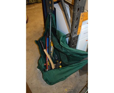 A BAG CONTAINING GARDEN TOOLS, including a stainless steel bladed spade and fork