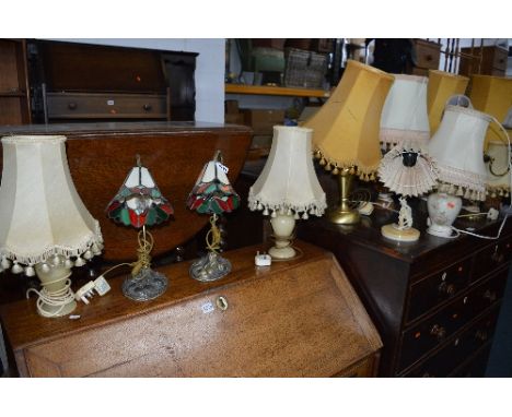 A PAIR OF TIFFANY STYLE TABLE LAMPS, a glazed table lamp, eight other table lamps and an onyx table lamp (12)