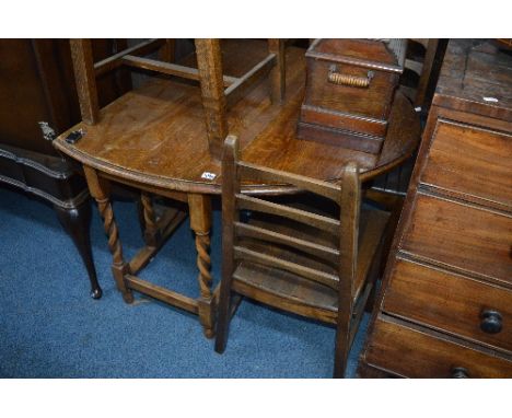 AN OAK BARLEY TWIST DROP LEAF TABLE, and four country oak ladder back chairs (webber label attched to chairs) (5)