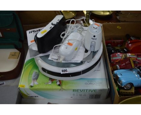 A IROBOT ROOMBA VACUUM CLEANING ROBOT, together with a boxed Revitive circulation booster (2)