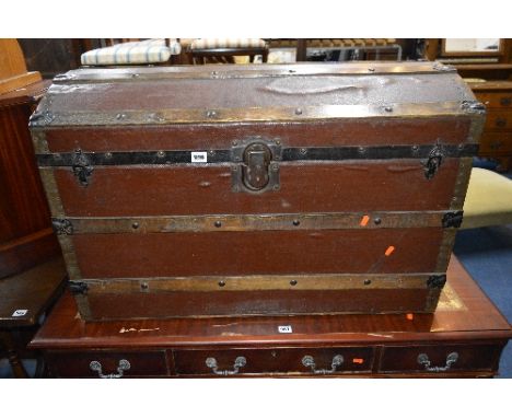 A VINTAGE DOMED TOPPED TRUNK, with metal and wooden banding, J. Ingram refs, Trunk & Bag Depot, 54 St Mary's Street, Cardiff 