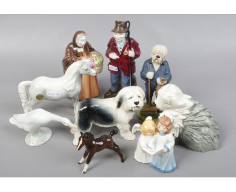 A group of ceramic figures to include John Beswick, Royal Doulton Coalport etc.