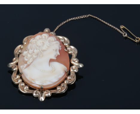 A 9ct gold shell cameo brooch portrait of a maiden, makers mark for WJP with safety chain.