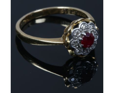 A vintage 18ct gold and platinum ruby and diamond floriform cluster ring, size P.