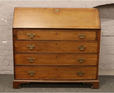 A Georgian mahogany bureau over four drawer chest with fitted interior raised on bracket feet, 125cm W x 54cm D x 117cm H.