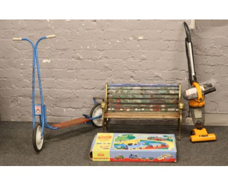 A child's garden bench, vintage Bantel Cat scooter, My First Hornby in box and a child's working vacuum cleaner.