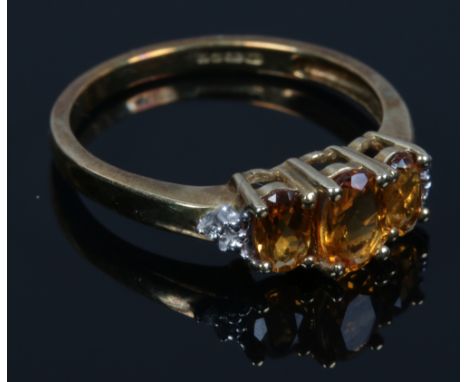 A 9ct gold citrine and diamond ring. With certificate, size N.