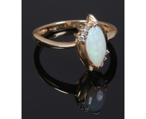 A 14ct gold marquise opal and diamond ring. Size O.