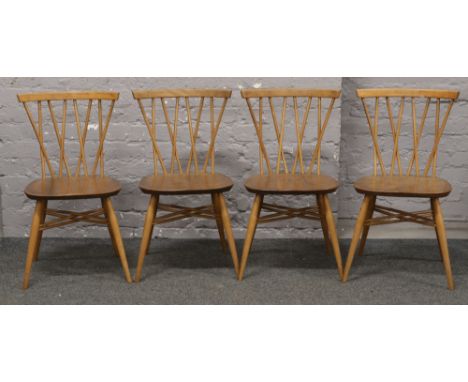 A set of four Ercol elm candlestick lattice dining chairs.
