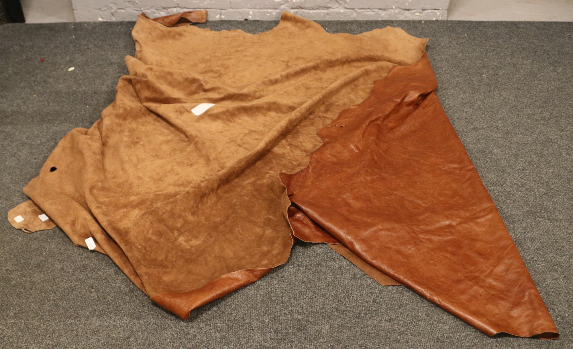 A tan leather cow hide by Yarwood Leather Products Ltd, 4.85 square metres.