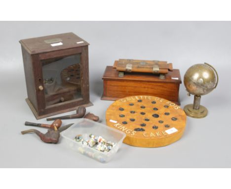 A John Watts ironing tie press, an oak pipe cabinet, globe cigarette dispenser, a Galette de Rois Kings Cake advertising plaq