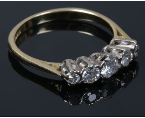 An 18ct gold five stone diamond ring set with brilliant cut stones, principle stone approx 0.4ct, size Q1/2.