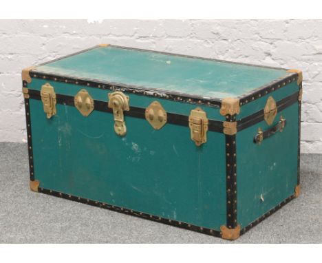 A vintage canvas bound steamer trunk.